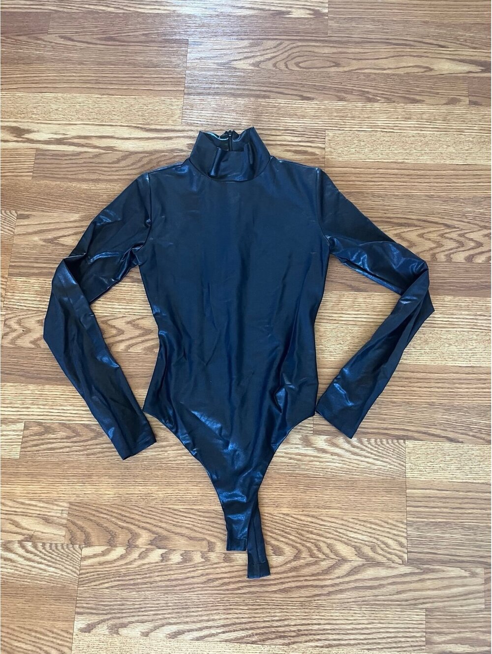 Women’s Naked wardrobe metallic bodysuit. Size Medium.
